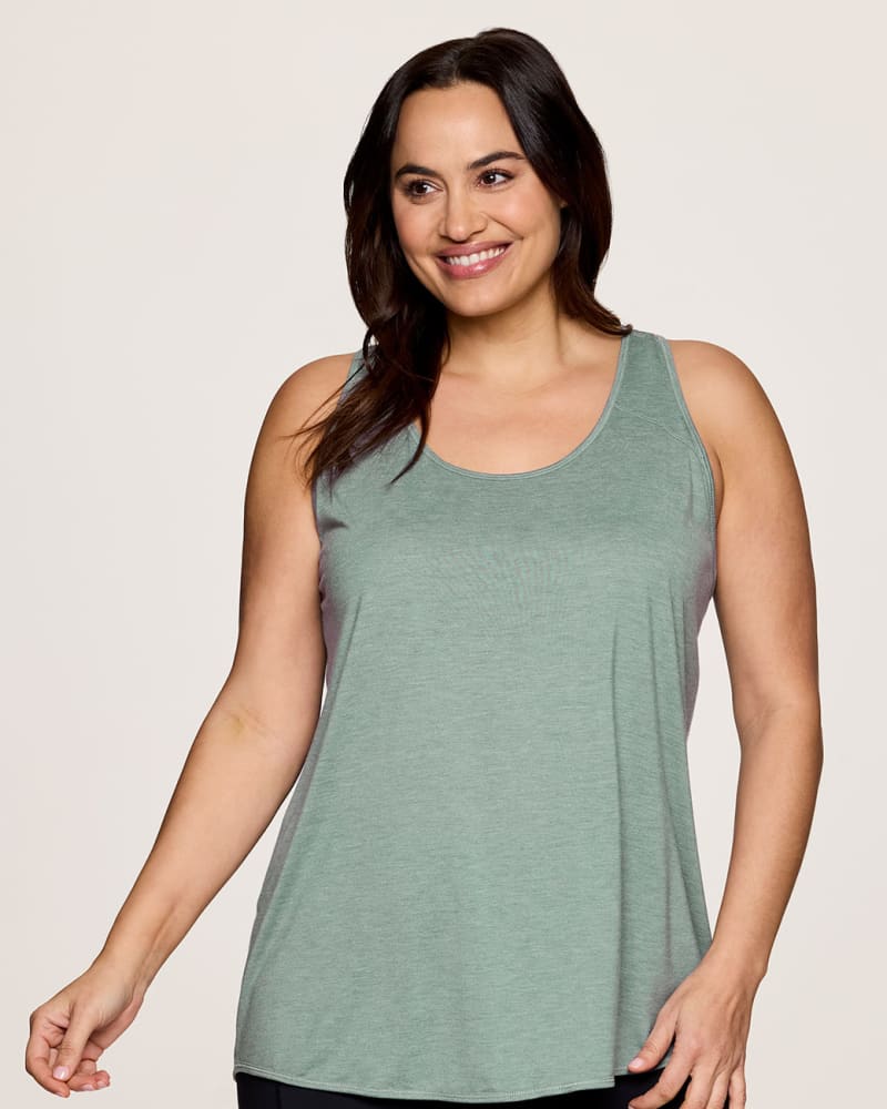 Front of a model wearing a size 3X Prime Relaxed Twist Back Tank Top in Sea Glass by RBX Active. | dia_product_style_image_id:348466